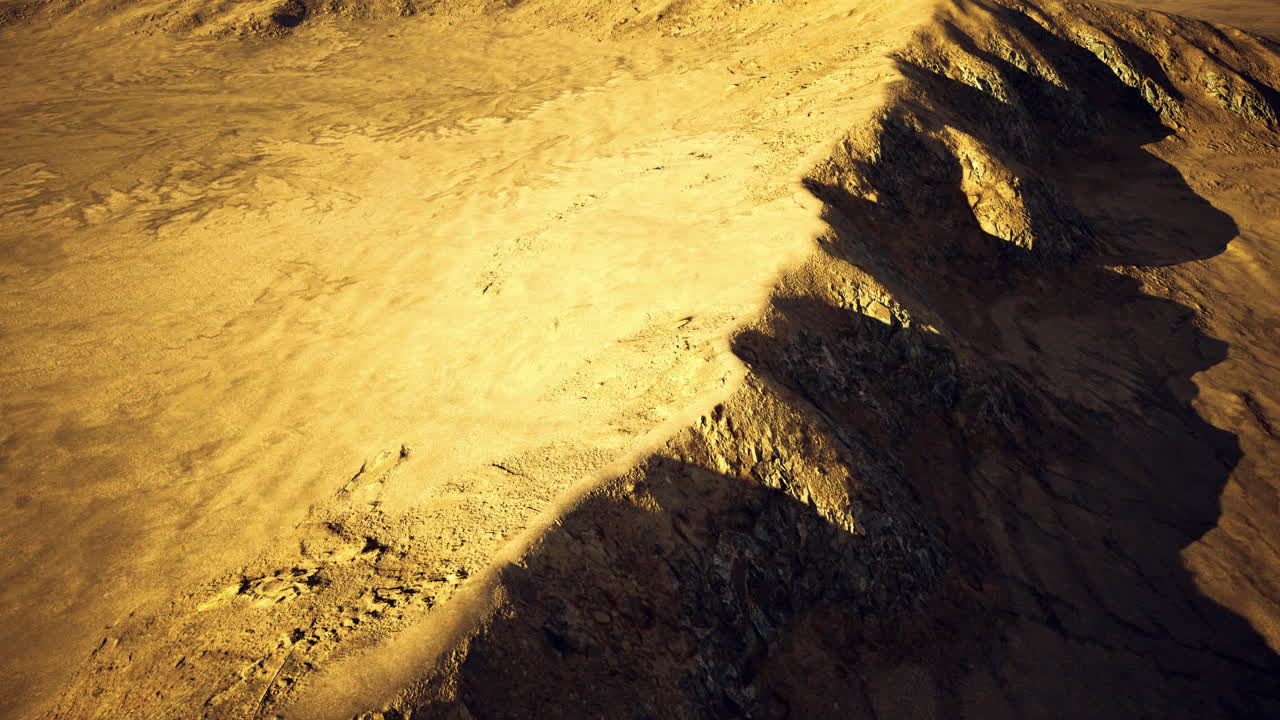 Exploring the rugged golden terrain of an alien landscape at sunset