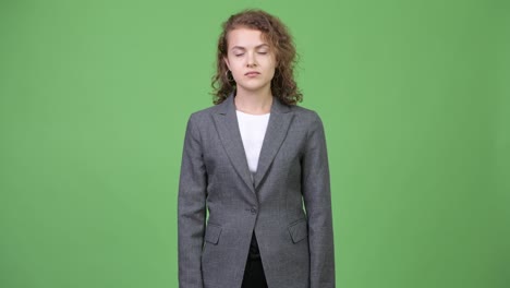 happy young beautiful businesswoman pointing up