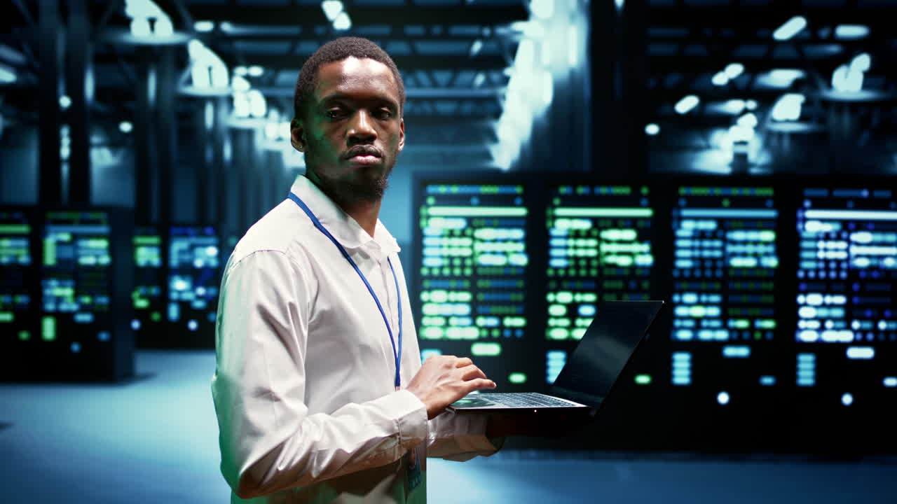 Admin walking through server rackmounts