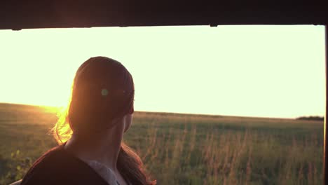 woman on safari at sunset