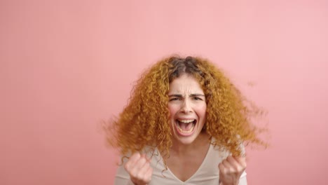 woman expressing different levels of anger on pink background