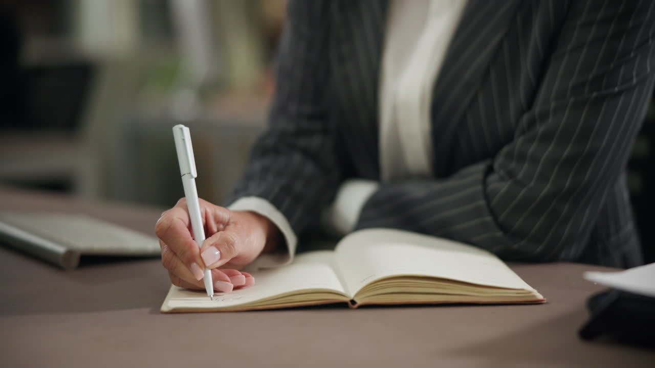 Woman writing in a notebook