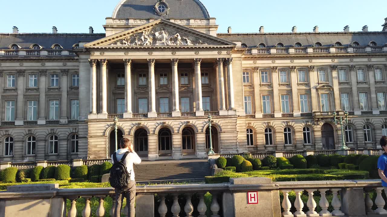 Brussels, Belgium- September 2, 2021: Man photographing the facade of the Royal Palace of Brussels