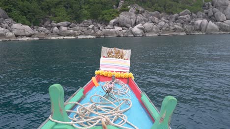 thai long-tail boat floating in the rock bay, koh tao island,thailand
