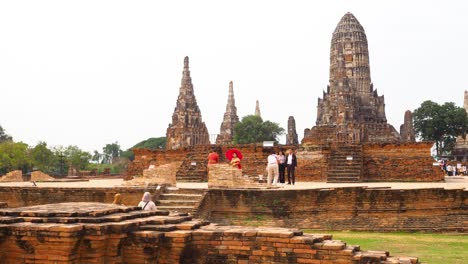 tourists walking around ancient temple ruins