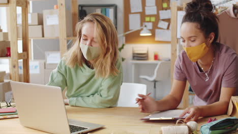 two women working together in a small business office