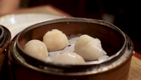 steamed dumplings served in bamboo baskets