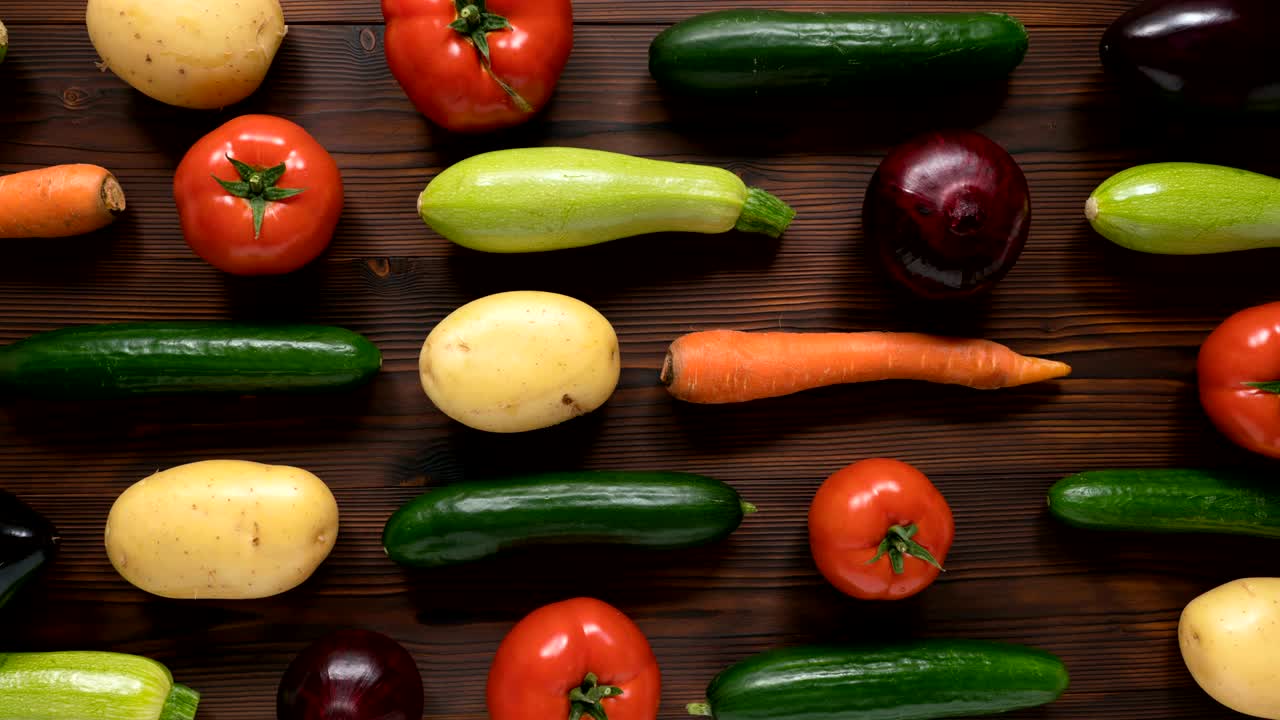 Moving vegetables on kitchen table, harvest background