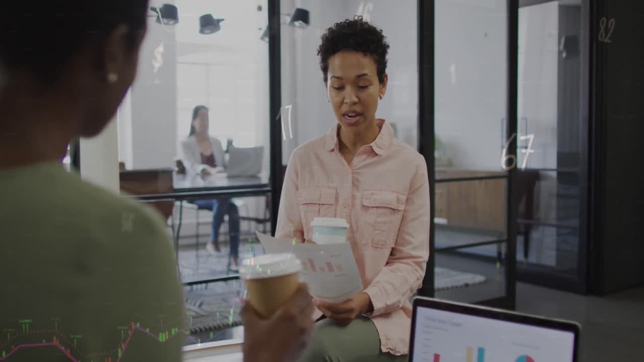 Animation of numbers and symbols over diverse business people at office