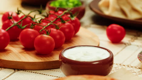 adjarian khachapuri with tomatoes and sour cream