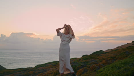 romantic lady dancing nature at evening vertically. positive woman posing camera