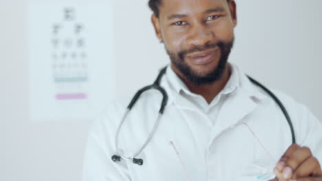 optometry, vision and a man cleaning glasses