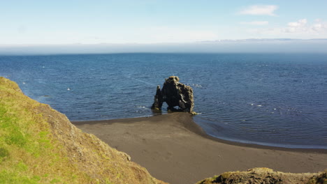 hvítserkur basalt rock stack formation in eastern iceland on sunny day