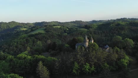 Chateau-de-Puy-de-Val-castle-surrounded-by-woods,-Espagnac,-Corrèze-in-France