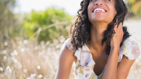 mixed race woman smiling with eyes closed on a sunny day