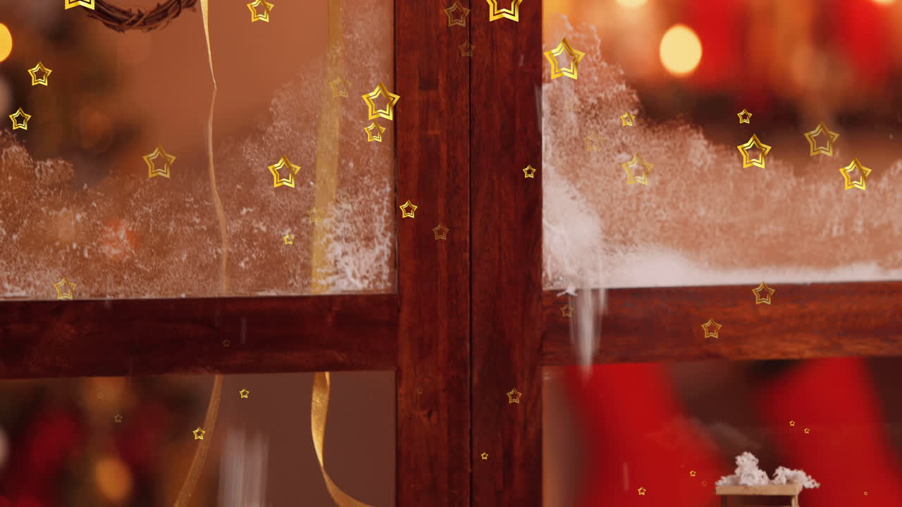 크리스마스 장식과 함께 겨울 창문 위로 떨어지는 별들의 애니메이션