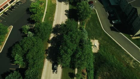 car-hauler-hotshot-pickup-truck-driver-is-driving-on-road-and-hauling-3-cars-drone-footage-4k