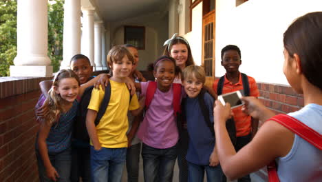 schoolchildren taking a photo together