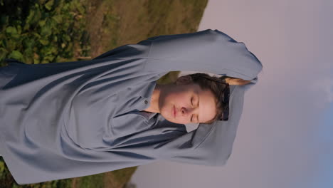 woman stretching in a field