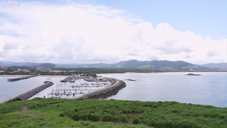 wide shot of coffs harbour marina and coastline, new south wales, australia