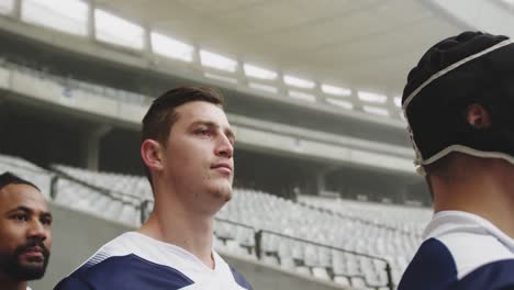 male rugby players standing in the stadium 4k