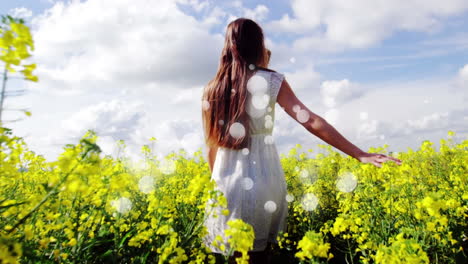 pareja joven caminando en un campo de flores con efectos de luz en primer plano