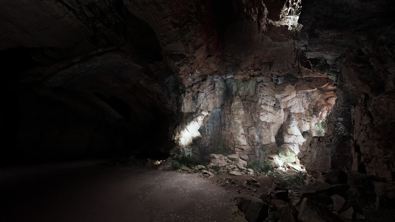 una cueva oscura con luz fluyendo dentro