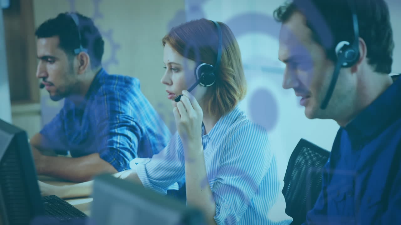 Animation of purple social icons floating over group of call centre workers