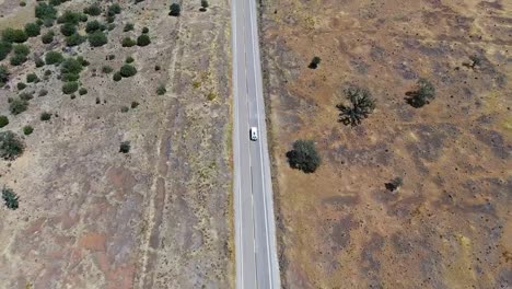 drone video of a road driven by cars in the middle of lassen national forest