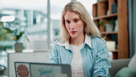 worried woman looking at laptop