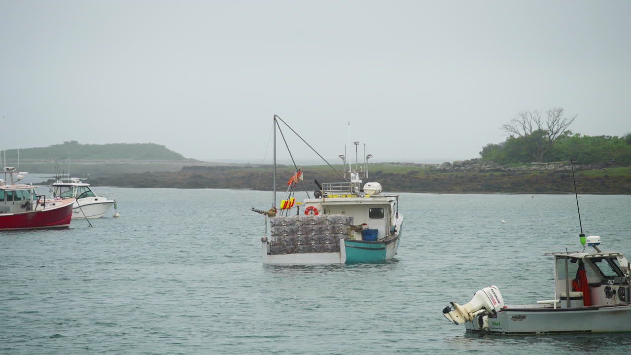 Classic lobster fishing boat in marina with fog rain and misty weather moody 4k 60p