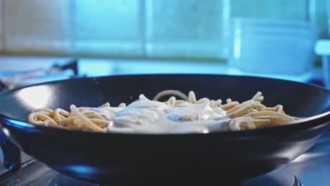 View-From-Front-Side-Of-Greek-Yogurt-Spaghetti-Sprinkled-With-Salt,-Pepper,-And-Parsley-On-Top