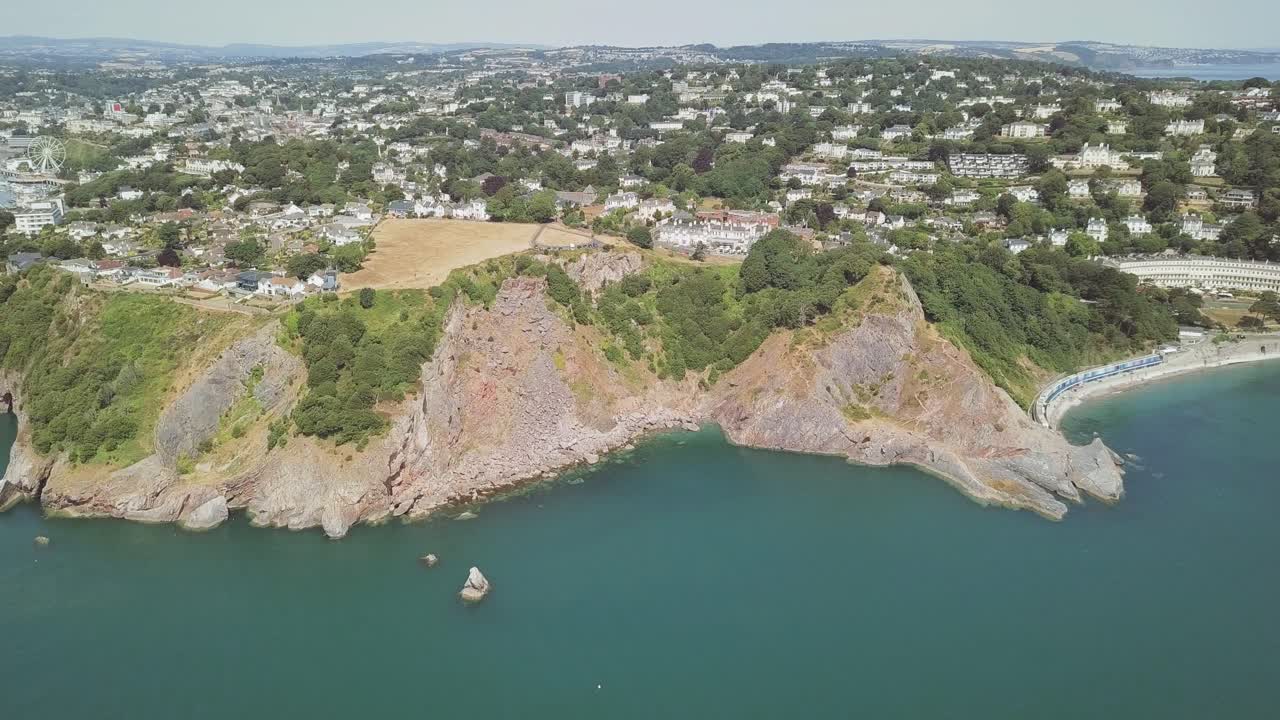 Coastal town landscape with cliffs and sea
