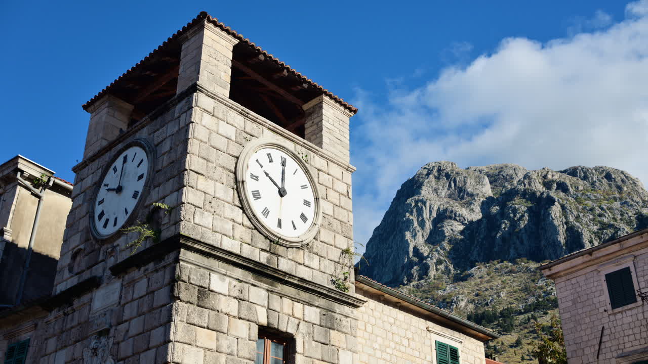 Stone clock tower standing in the ancient city of Kotor, Montenegro