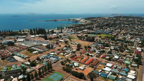 aerial view of esperance city in western australia on a sunny day with houses and commercial area in the foreground and the harbour in the background