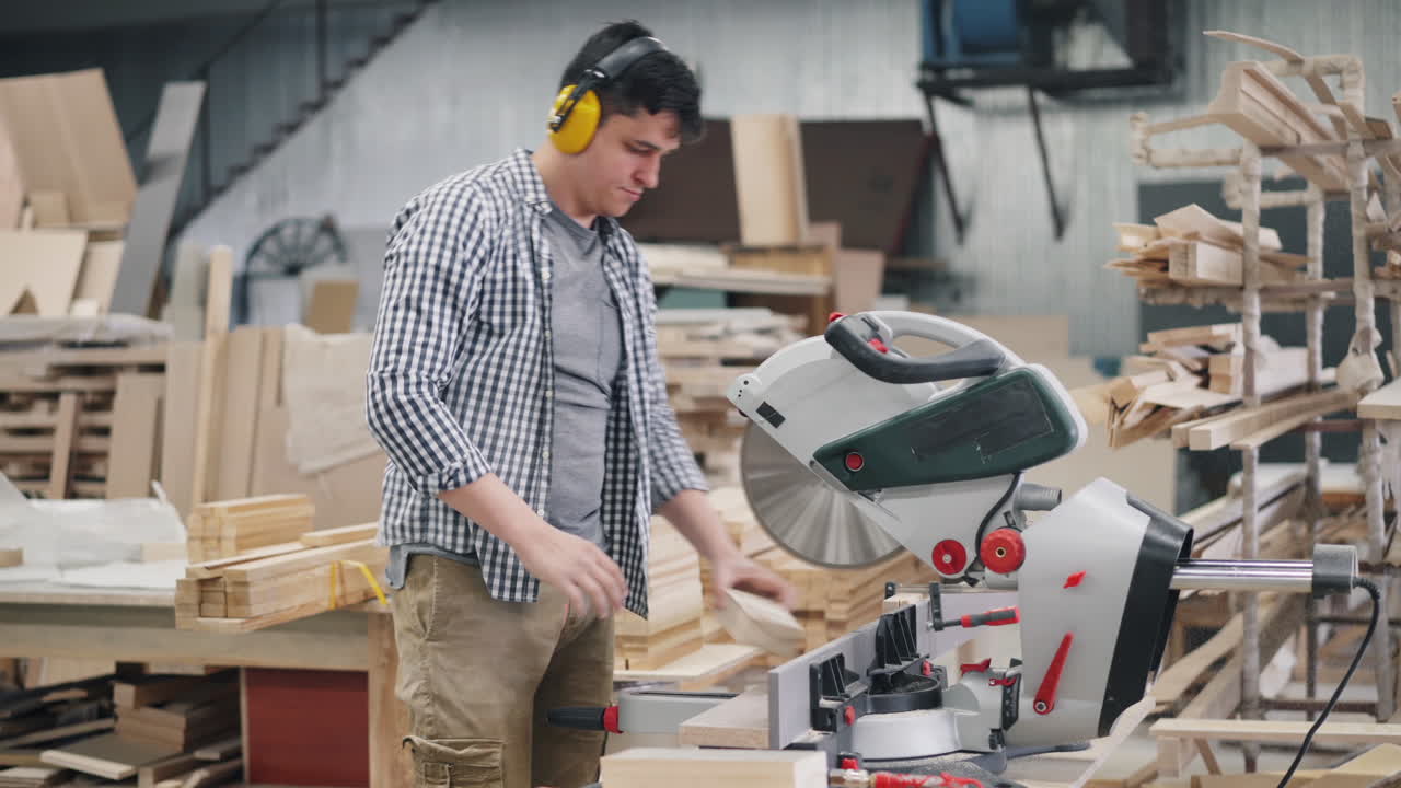Carpenter Using Circular Saw in Workshop