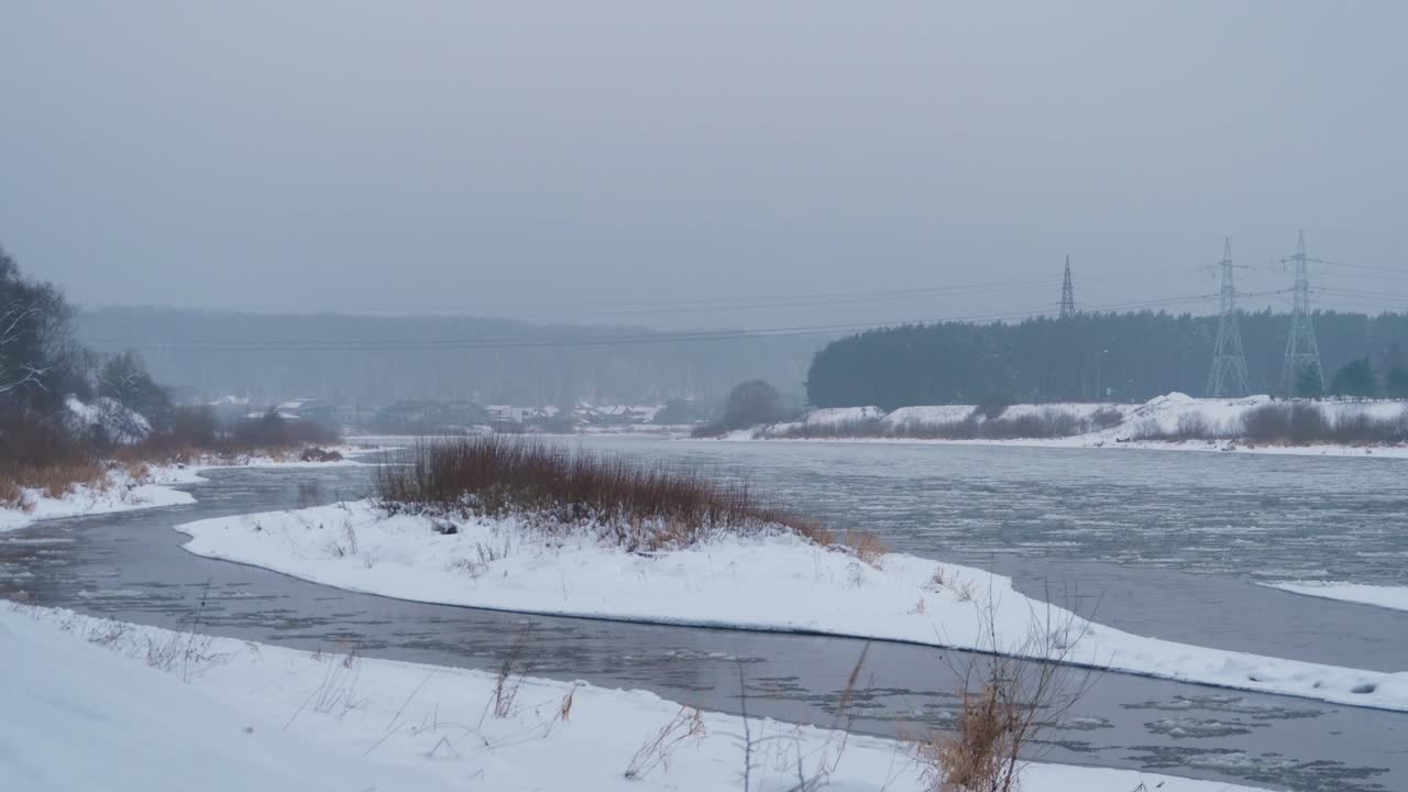 Timelapse of running river with a lot of ice blocks.