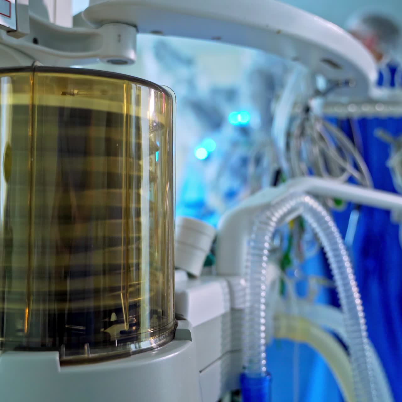 Anaesthesia machine ventilator. Medical equipment for saving patient's life in the operating room on the blur background of doctors. Close-up.