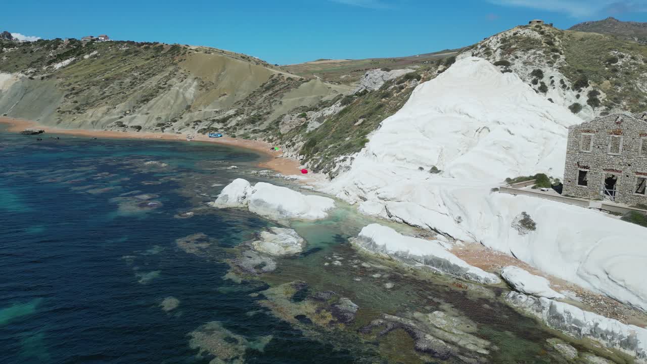 Aerial drone footage of Punta Bianca, Sicily: white limestone cliffs, turquoise sea, and untouched coastline. Perfect for travel, nature, and cinematic landscape projects