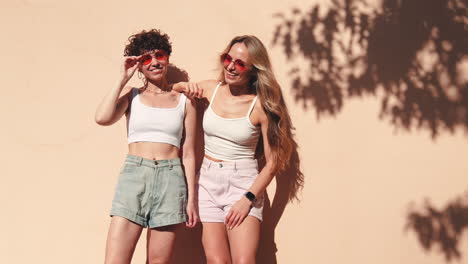 two happy women posing outdoors