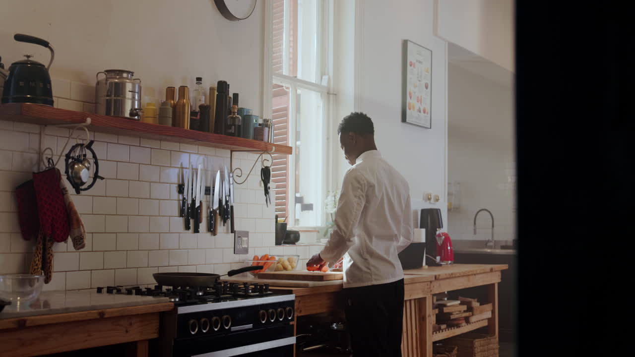 Chef preparing food in a bright kitchen