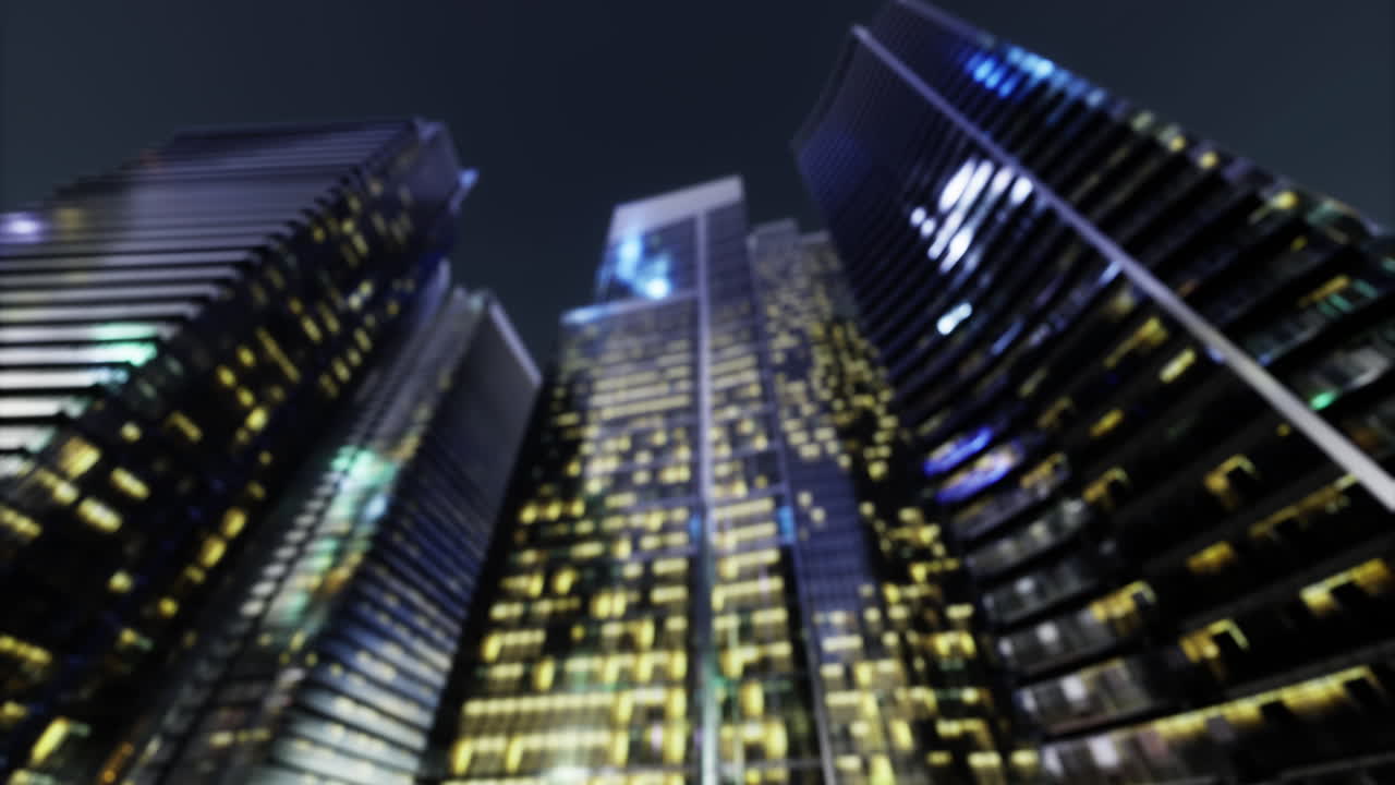 City lights shine on tall skyscrapers in a nighttime urban scene