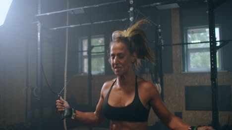 slow motion: skipping woman training at the gym. young woman skipping rope. athlete female jumping on skipping rope at cardio training in gym club.