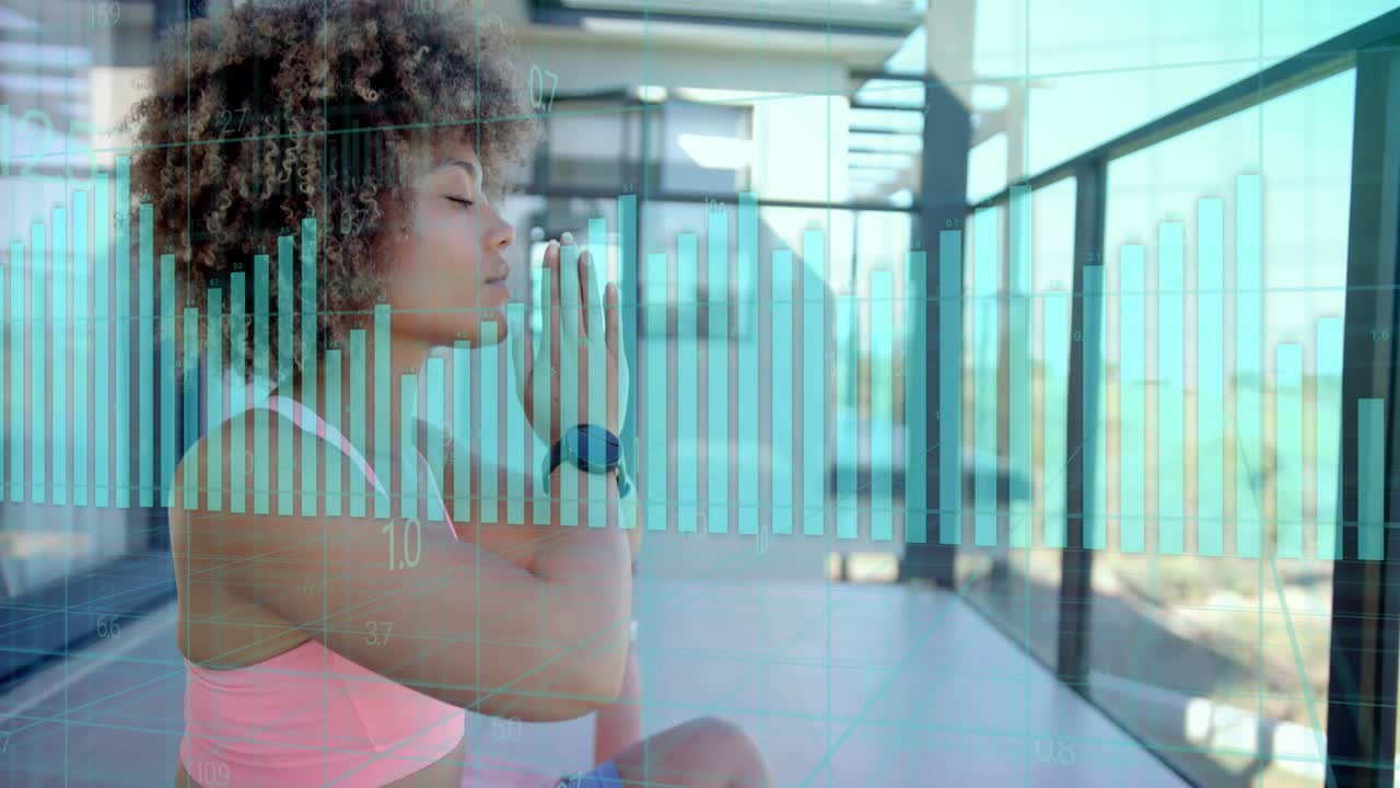 Woman doing yoga on balcony, watch sending data, numeric bar graphs overlaying around her for calm