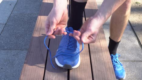 A-runner-is-tying-his-shoes