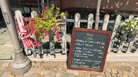 chalkboard menu displayed outside a restaurant in italy