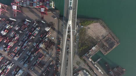 hong kong stonecutters bridge and container terminal and port at victoria bay including storage terminal, aerial footage