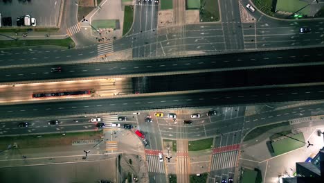 top down night city roads with cars driving aerial view