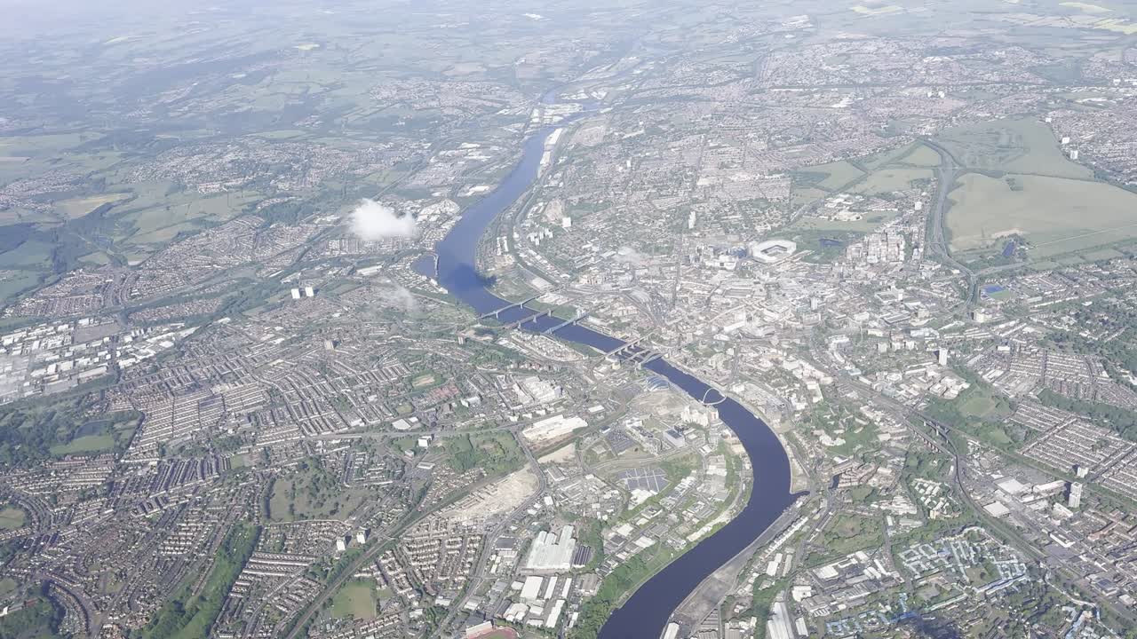 Aerial view via plane over Newcastle Upon Tyne Quayside and City Centre, with River Tyne Bridges and St James' Park