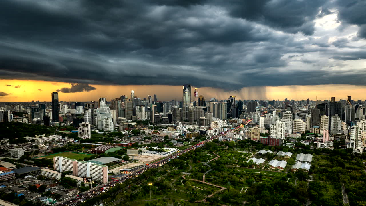 Bangkok city with dramatic storm clouds and traffic, sunset drone hyperlapse
